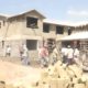 Construction workers build a house in Kisumu.