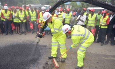 Engineers fix a pothole on Ngong Road