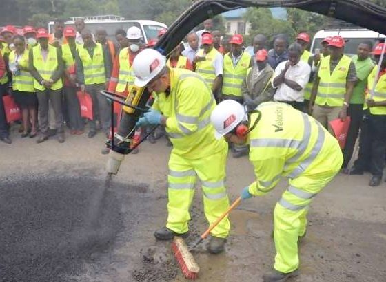 Engineers fix a pothole on Ngong Road