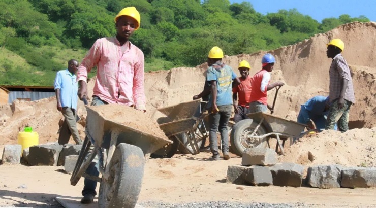 Workers harvesting sand in Makueni