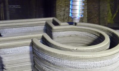A 3D concrete printer at work.
