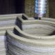 A 3D concrete printer at work.
