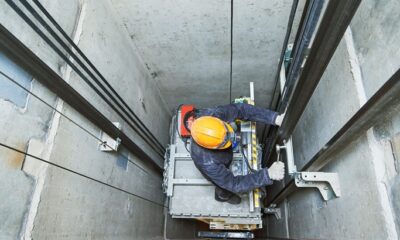 Technician repairs an elevator