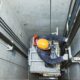 Technician repairs an elevator
