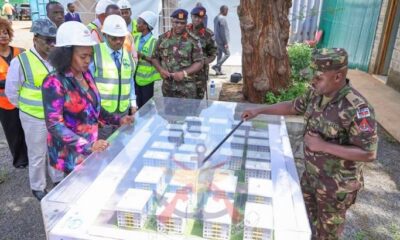 Soipan Tuya reviews KDF housing plans.
