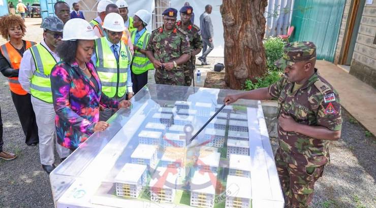 Soipan Tuya reviews KDF housing plans.