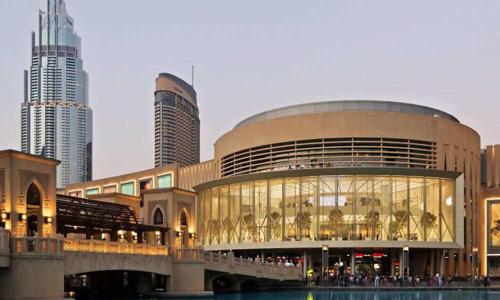Exterior view of Dubai Mall with Burj Khalifa in the background.