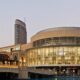 Exterior view of Dubai Mall with Burj Khalifa in the background.